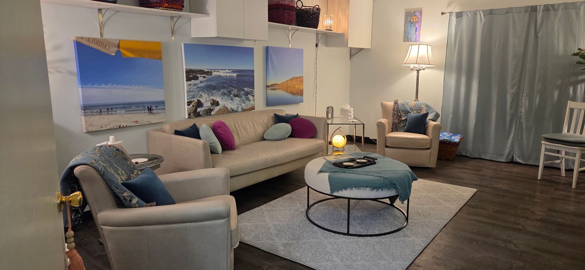 Karen Sussan's office in Suffern, NY, with coastal photographs on the walls